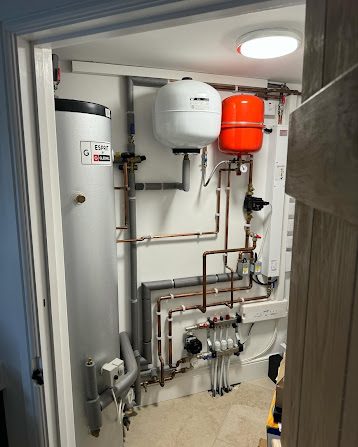 Copper pipework fitted neatly inside cabinetry