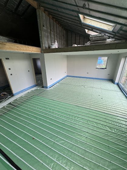 Underfloor heating pipework laid across a large open-plan room